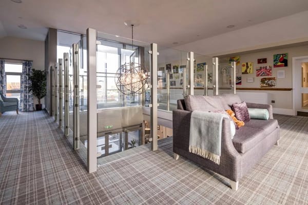 Bright interior lounge area with artwork and comfortable seating