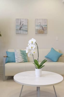 Modern lounge area with flowers and artwork