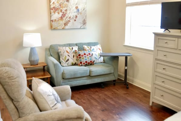 Cozy sitting area in a resident room with decorative elements