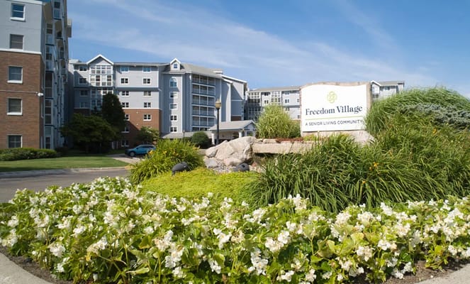 Exterior view of Freedom Village with landscaping