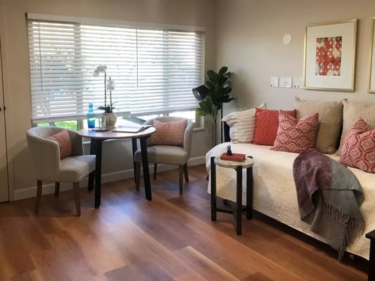 Cozy interior of a resident's room with seating area