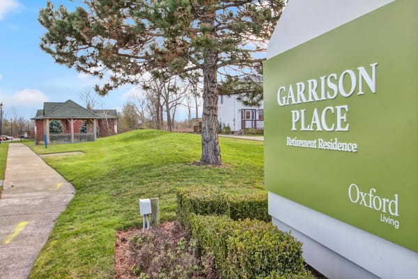 Exterior view of Garrison Place retirement residence signage