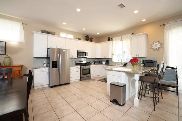 Bright kitchen area with modern appliances