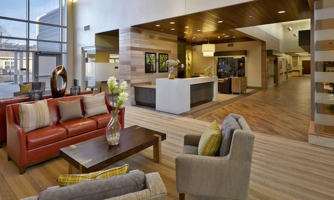 Modern lobby area with seating and reception desk