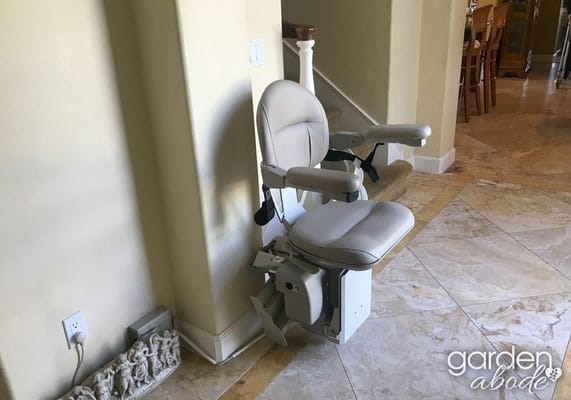 Stairlift chair in a residential hallway