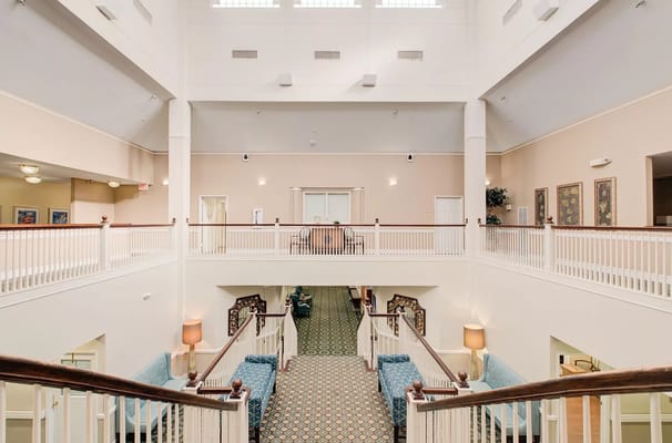 Bright and spacious lobby area with seating and art decor