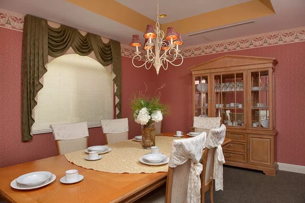 Dining room with a wooden table set and elegant decor