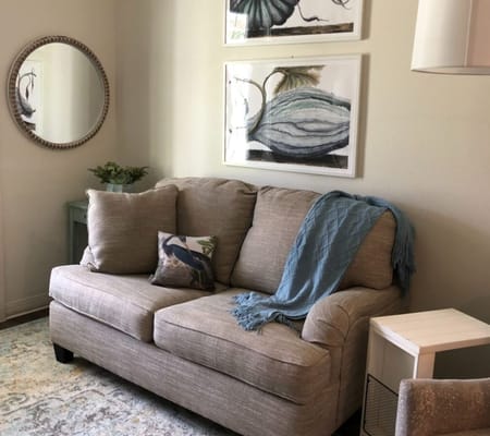 Cozy seating area with a couch and artwork