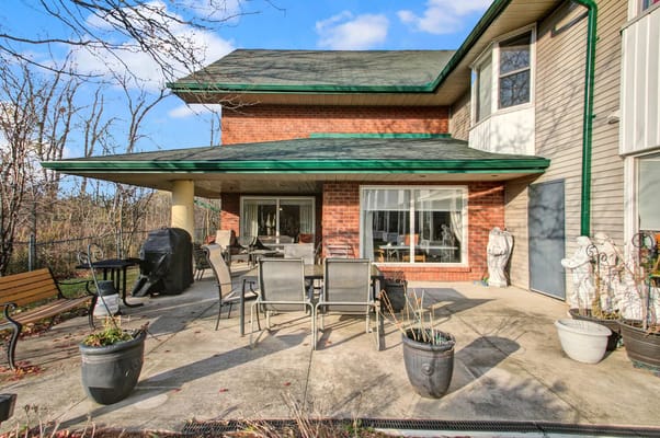 Patio area with outdoor seating and grill