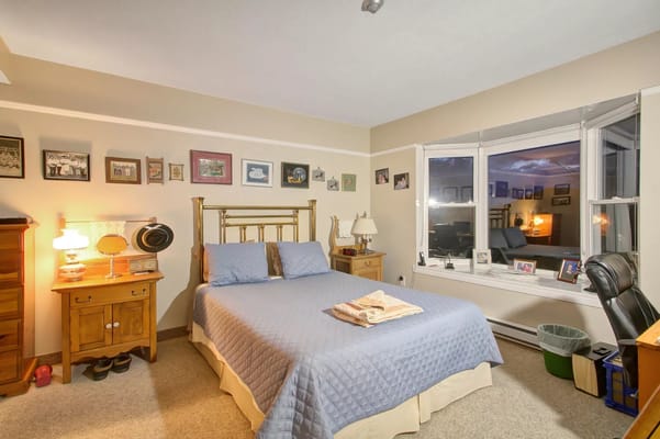 Cozy resident room with a bed and personal decorations