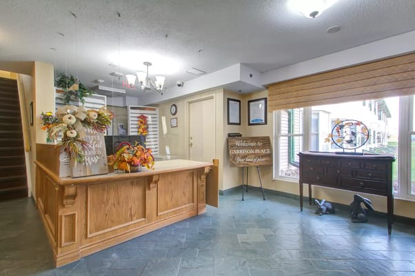 Welcoming reception area of Garrison Place with autumn decor