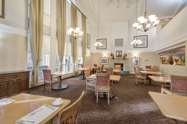 Bright dining room with tables and chairs arranged
