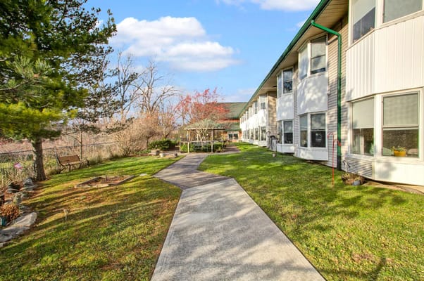 Pathway through a landscaped outdoor area of a facility