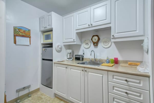 Bright and clean kitchenette area in a resident's room