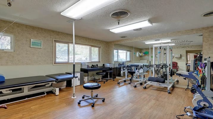 Therapy room with exercise equipment and seating