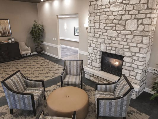 Interior lounge area with seating and a fireplace