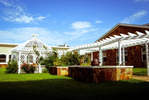 Beautiful outdoor garden area with gazebo and landscaping