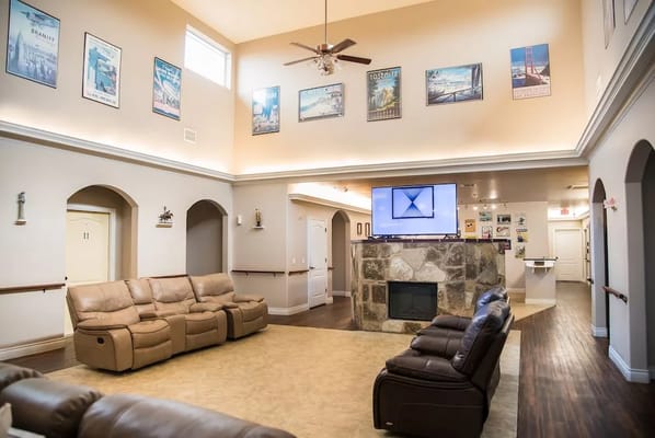Common area with seating and artwork on the walls