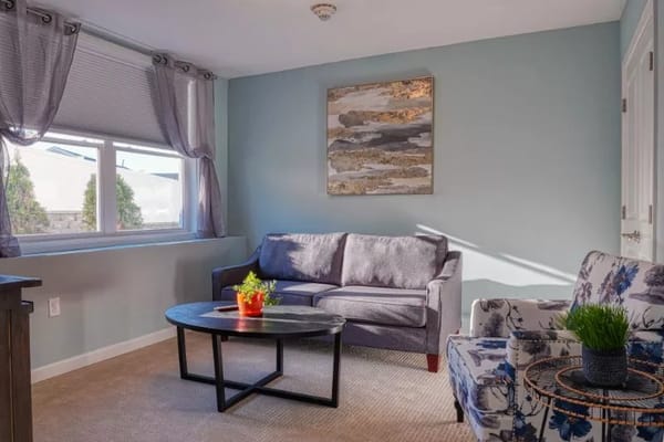 Cozy interior living space with sofa and artwork