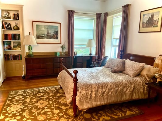 Cozy resident room with a bed and bookshelf