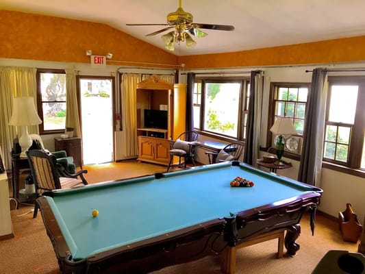 Common area with a pool table and seating