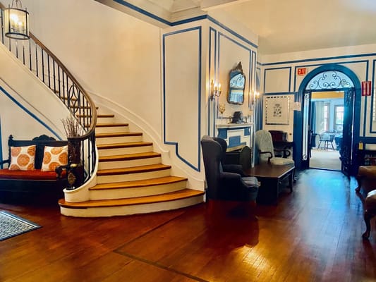 Interior view of a cozy common area with a staircase
