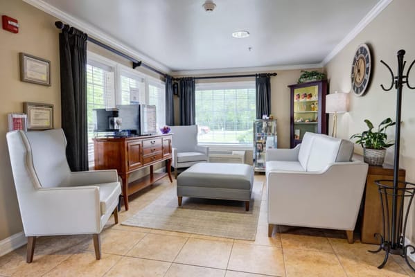 Bright living room area with comfortable seating and natural light.