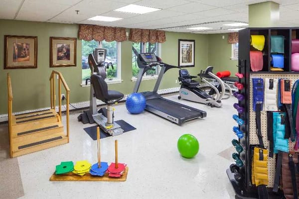 Activity room with fitness equipment and exercise aids