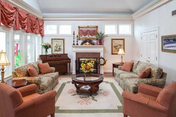 Warm living room with comfortable seating and decor.