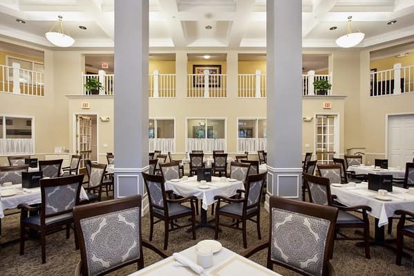 Interior view of a dining room with decorative tables and chairs