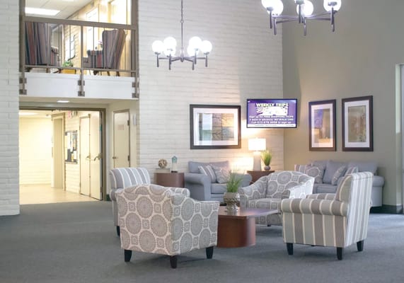 Common area with seating and decor in a nursing home