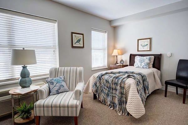 Cozy and well-lit resident room with furnishings