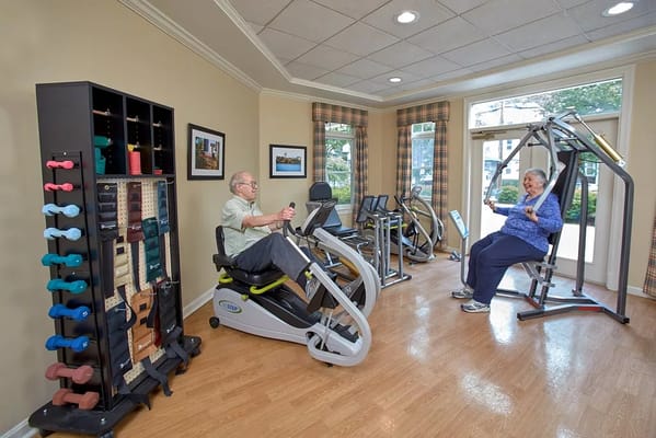 Residents exercising in a fitness area