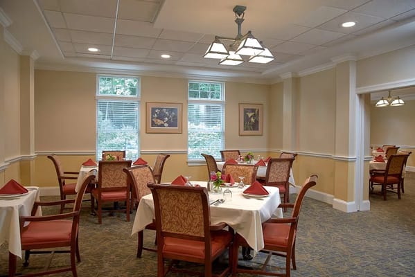 Dining room with tables set for a meal