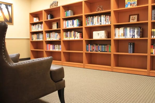 Cozy reading area with bookshelves and seating