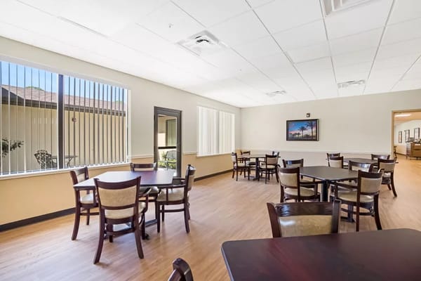 Bright common area with tables and chairs
