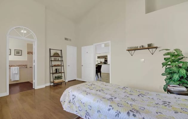 Cozy private resident room with floral bedding