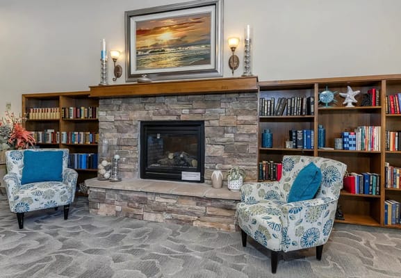 Interior common area with fireplace and seating.