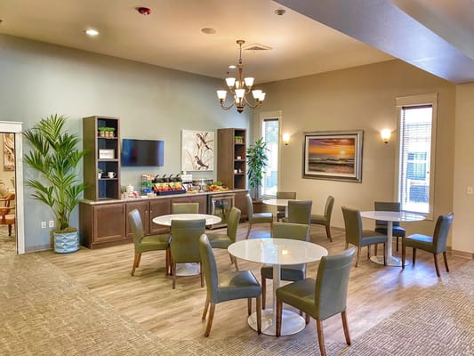 Bright common area with tables and chairs