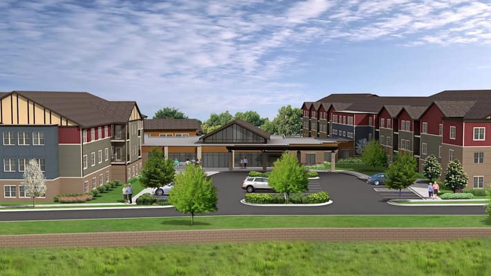 Exterior view of Grace Commons with residents and vehicles