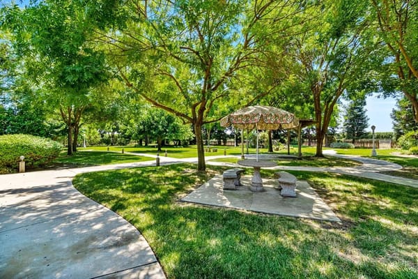 Outdoor garden space with a gazebo and walking paths