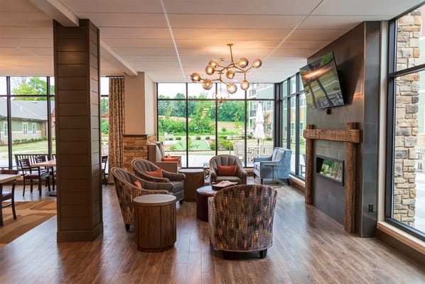 Bright common area with comfortable seating and large windows