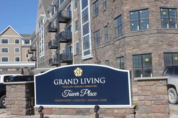 Sign for Grand Living At Tower Place