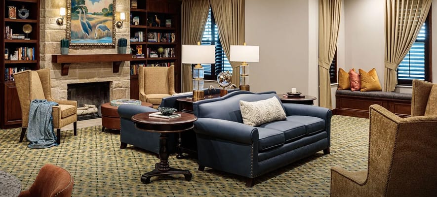 Cozy common area with comfortable seating and bookshelves