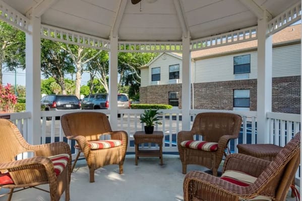 Outdoor gazebo with seating area for residents