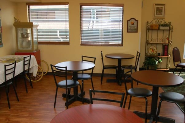 Interior view of a common area with tables and chairs