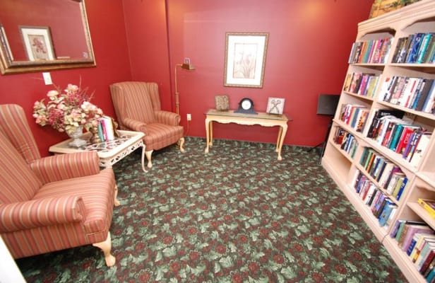 Cozy reading nook with bookshelves and armchairs