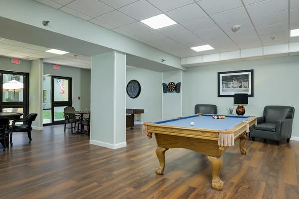 Interior common area with a pool table and seating