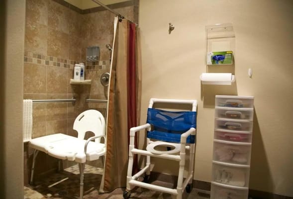 Accessible bathroom with shower and chairs