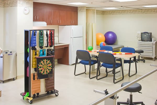 Activity room with exercise equipment and seating
